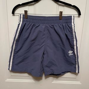 Men’s Adidas 3 stripe, meshed lined swim shorts. Mid rise